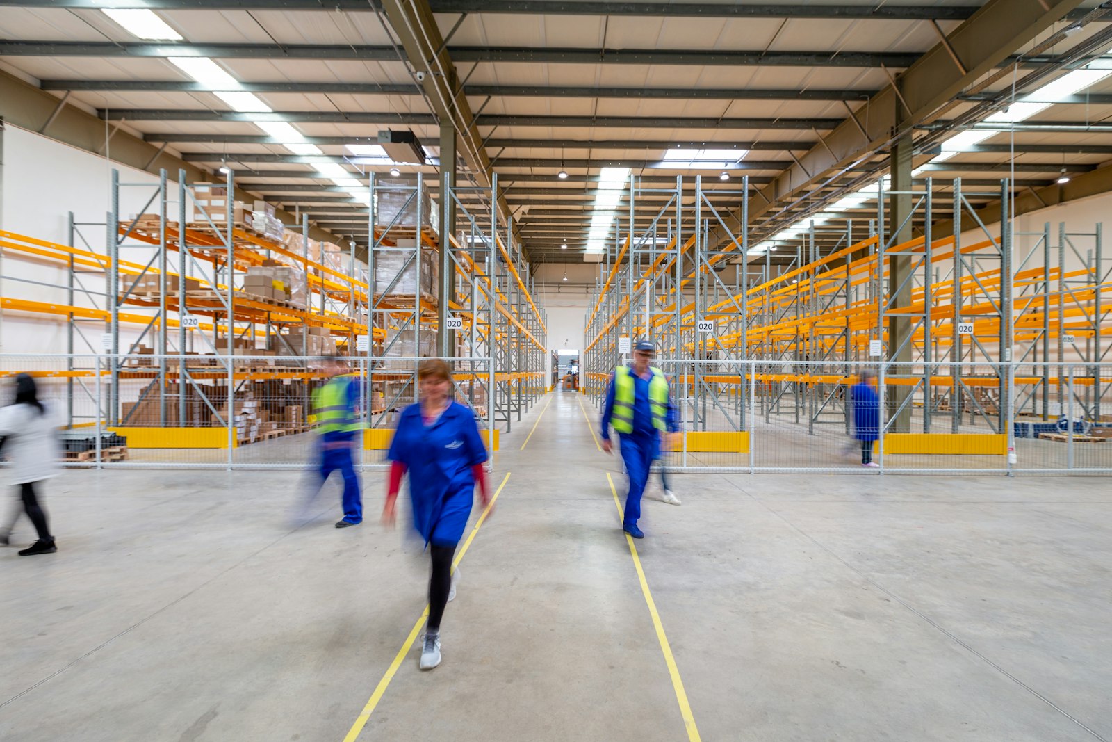 Team walking through a warehouse aisle — ShivShakti industrial sourcing and supply partner